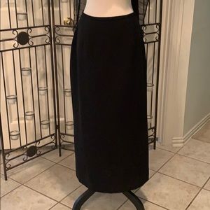 Midi-length lined black skirt with back slit